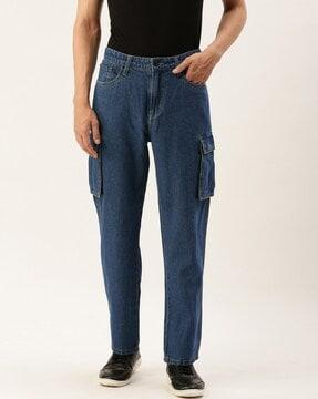 lightly washed relaxed jeans with flap pockets