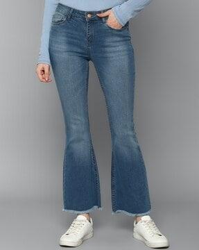 lightly washed relaxed jeans with frayed hems