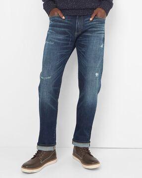 lightly washed skin-fit light distress jeans