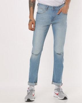 lightly washed skinny fit jeans with distressing