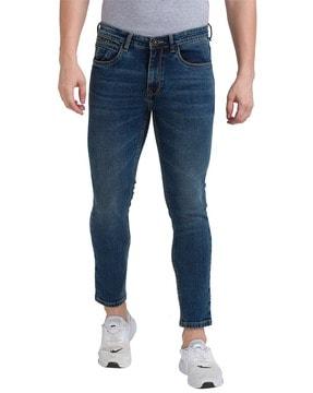 lightly washed skinny fit jeans with whiskers