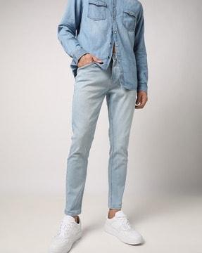 lightly-washed skinny fit jeans