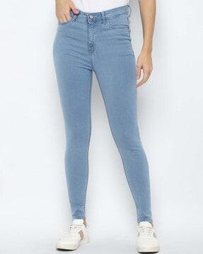 lightly-washed skinny jeans