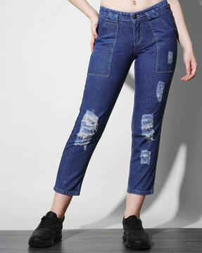 lightly-washed slim fit distressed jeans