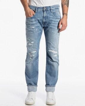 lightly washed slim fit distressed jeans