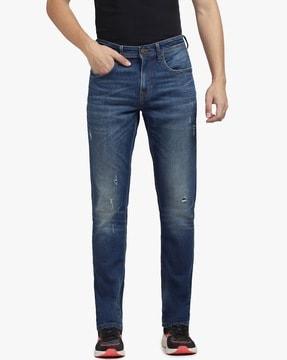lightly washed slim fit distressed jeans
