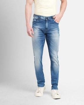 lightly-washed slim fit jeans