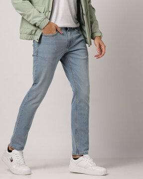 lightly washed slim tapered fit jeans