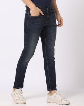 lightly washed tapered fit jeans