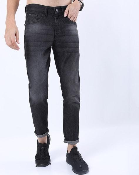 lightly washed tapered jeans