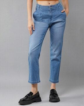 lightly-washed tapered jeans