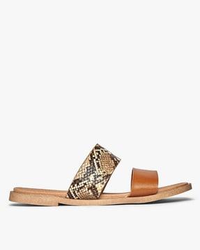 limo reptilian print flat sandals