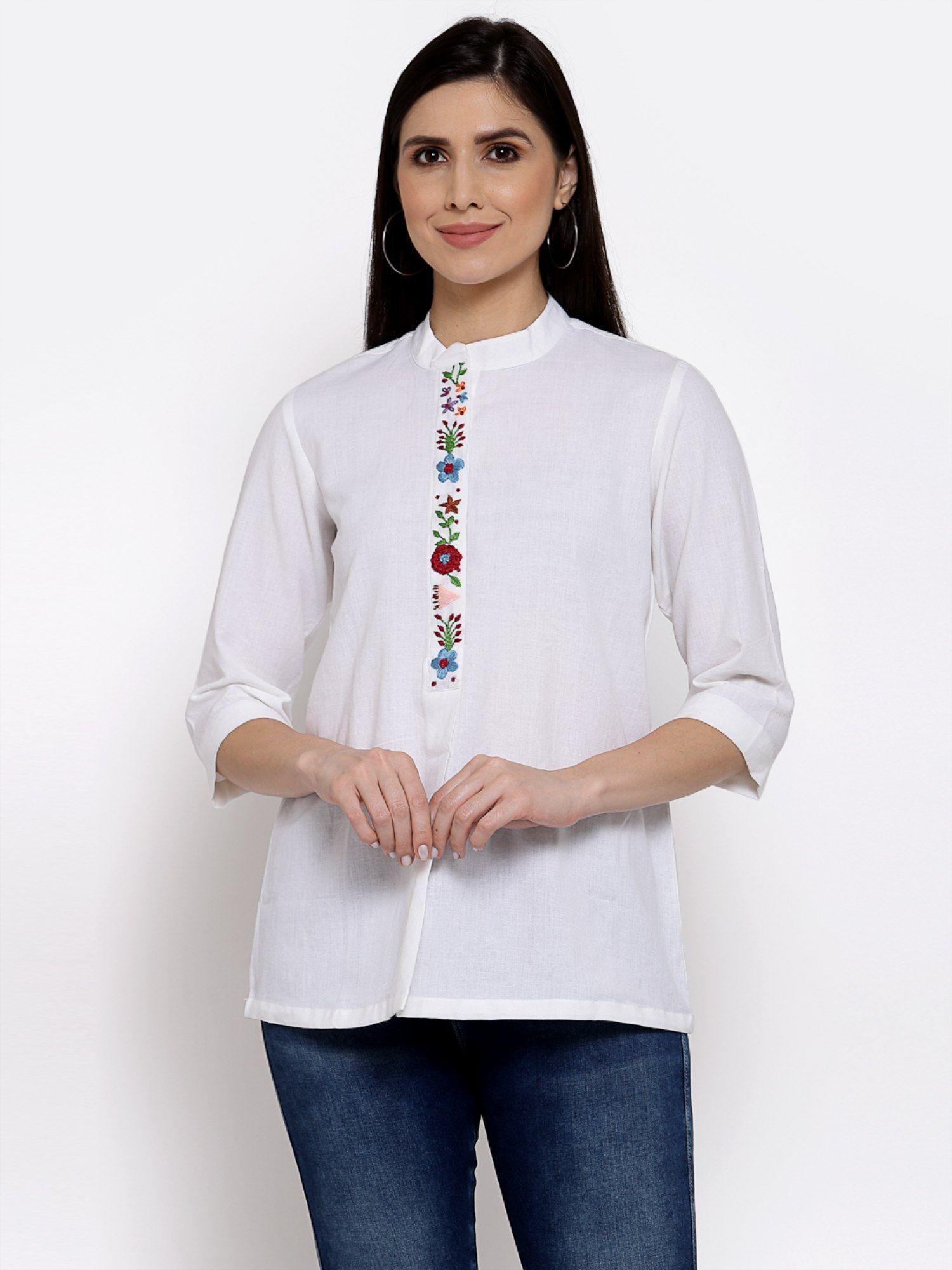 linen top with hand embroidery on it -white