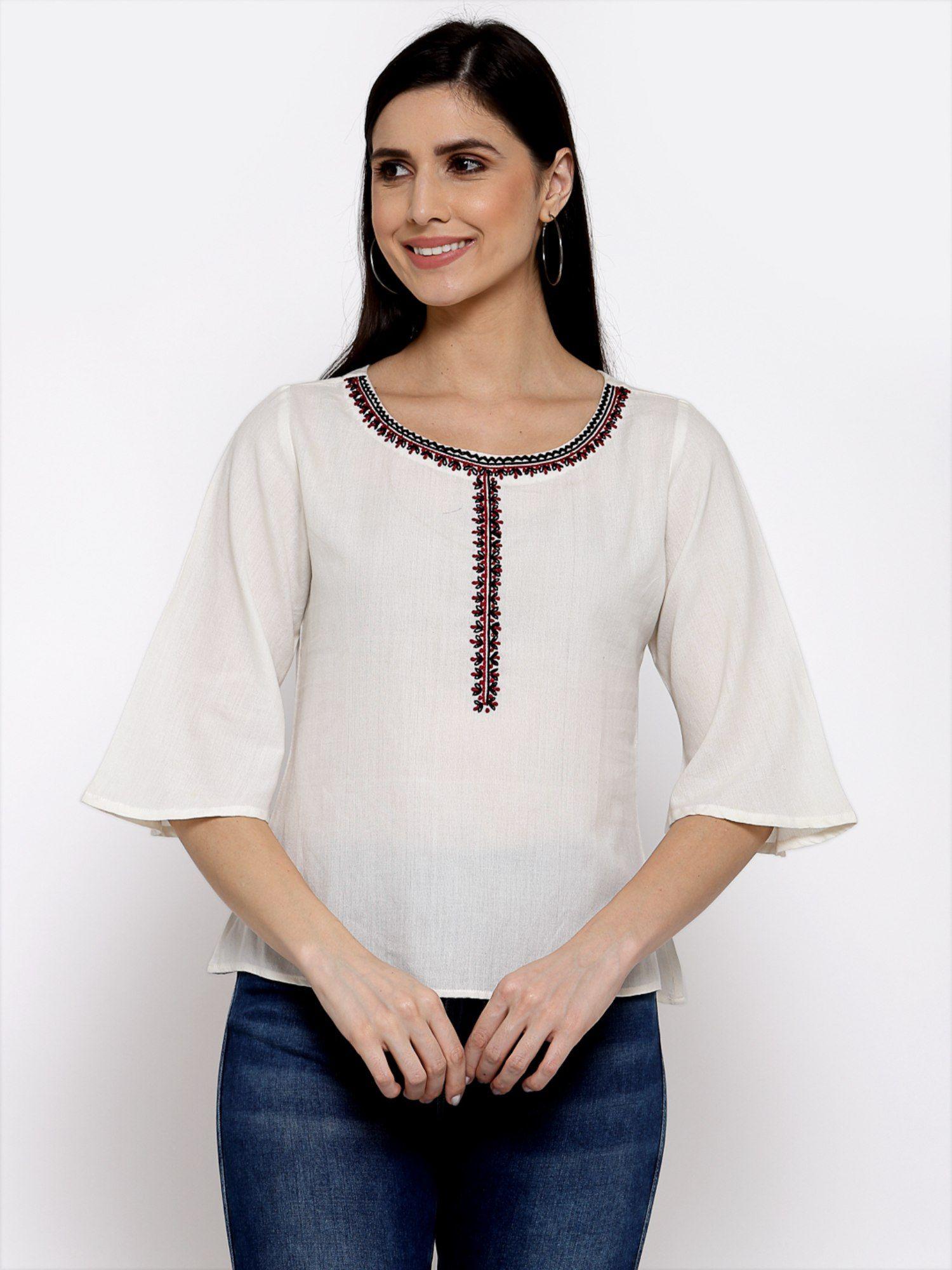 linen top with hand embroidery on it -white