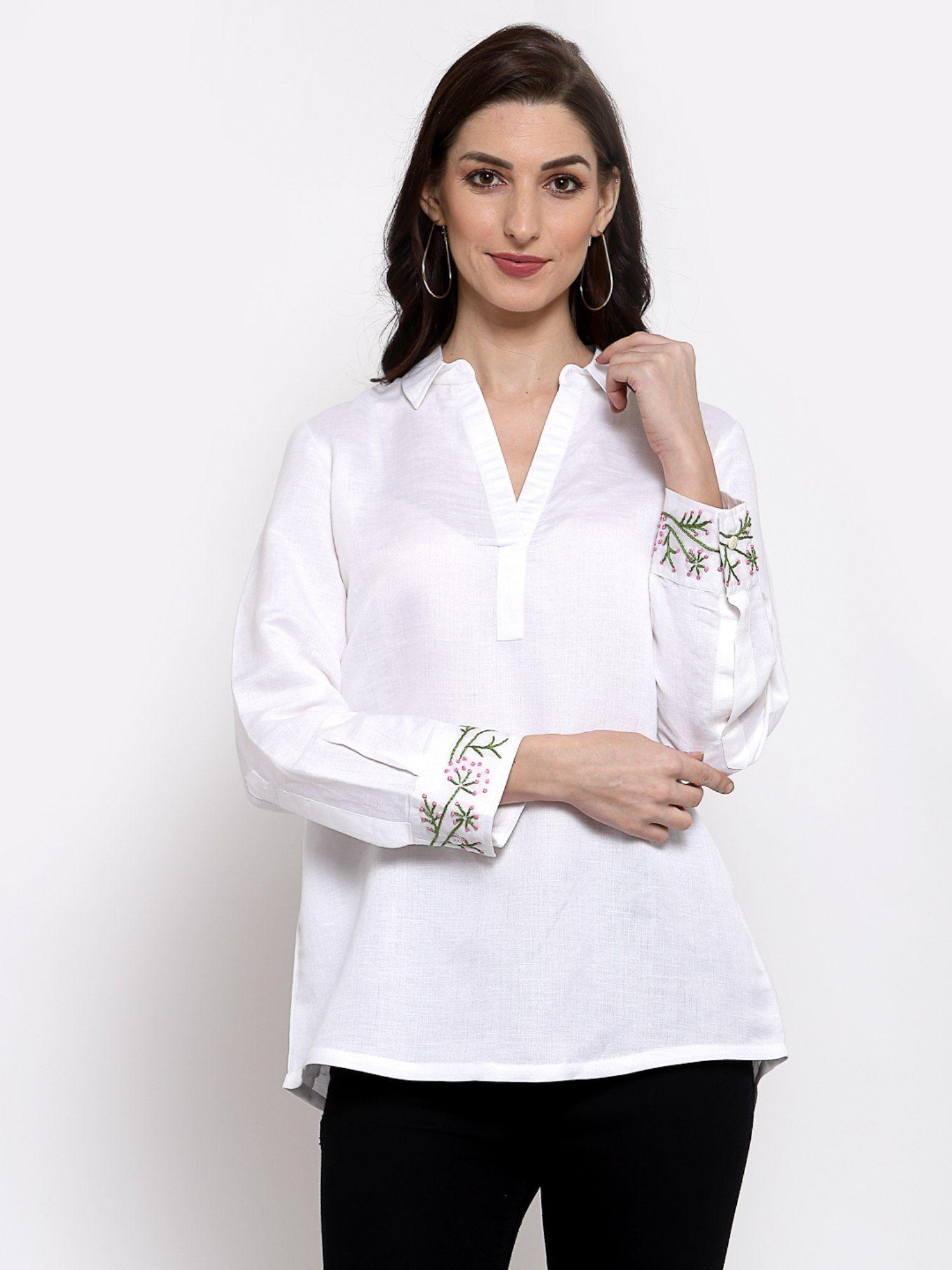 linen top with hand embroidery on it -white