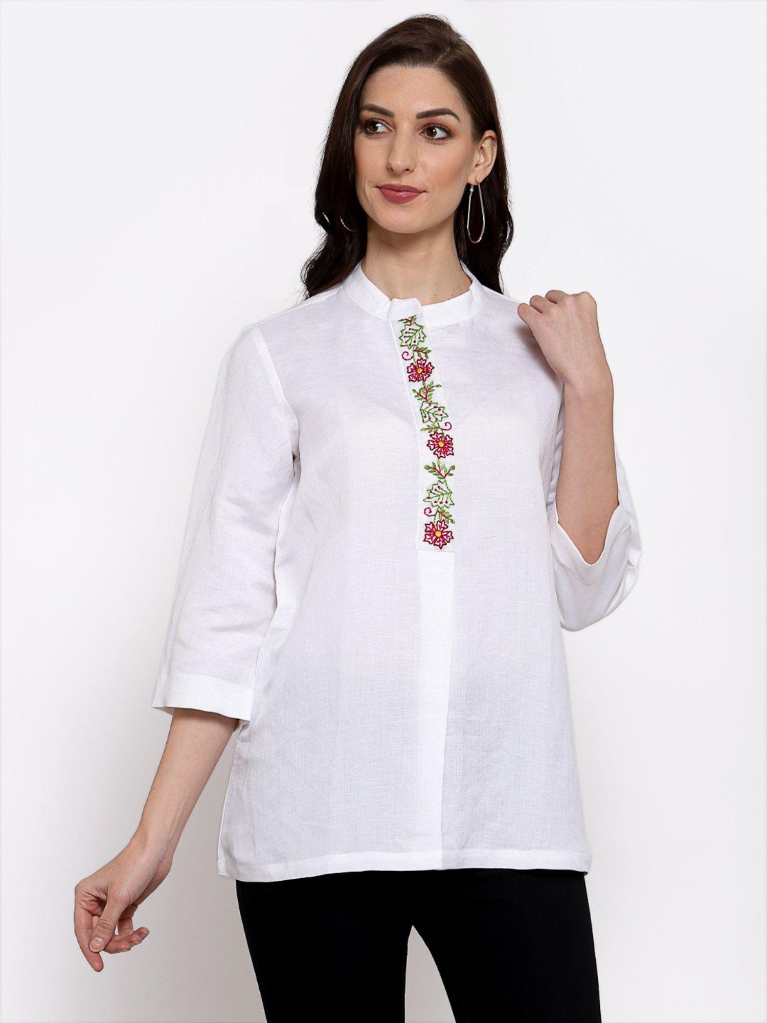 linen top with hand embroidery on it -white