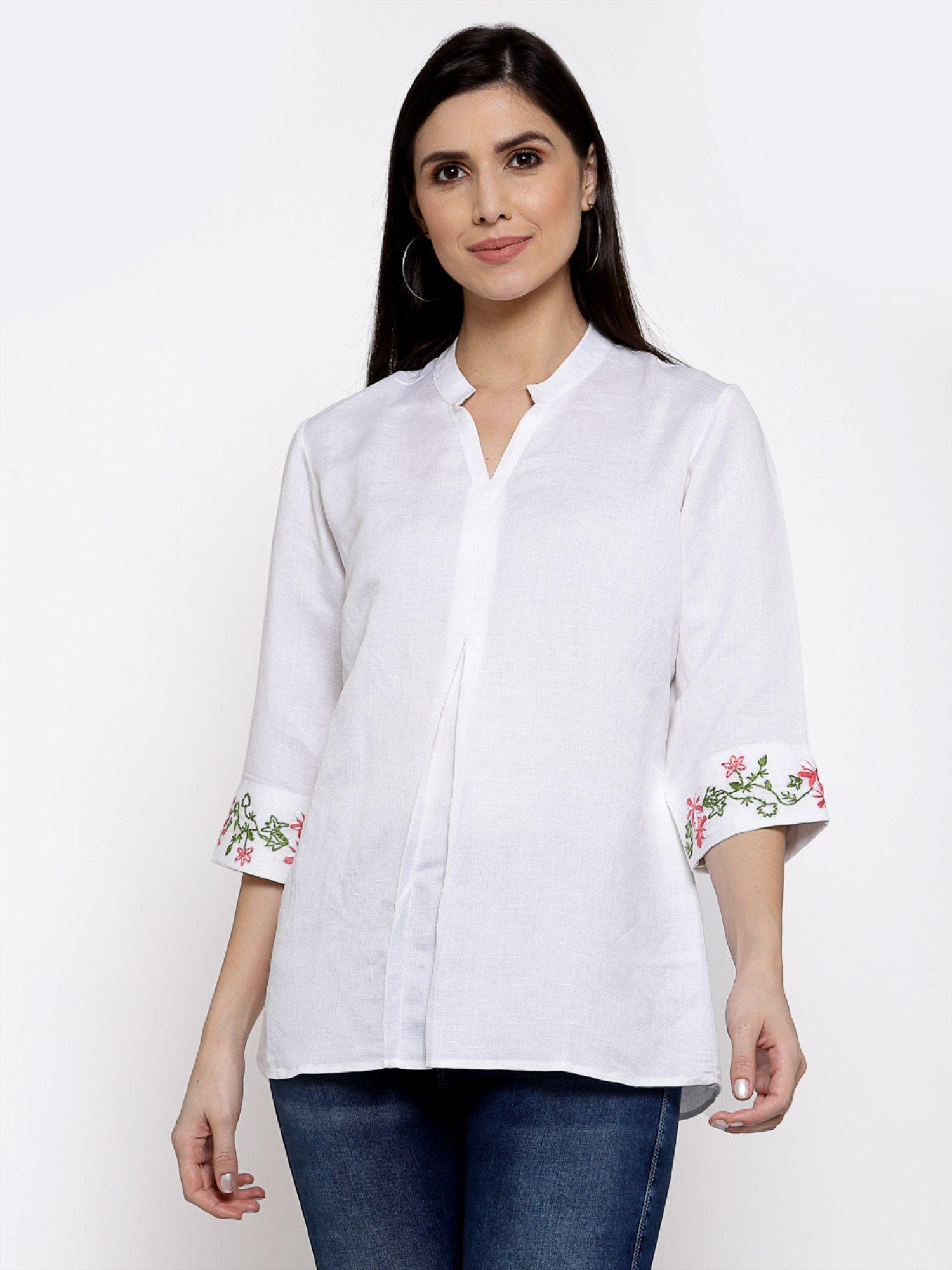 linen top with hand embroidery on it -white