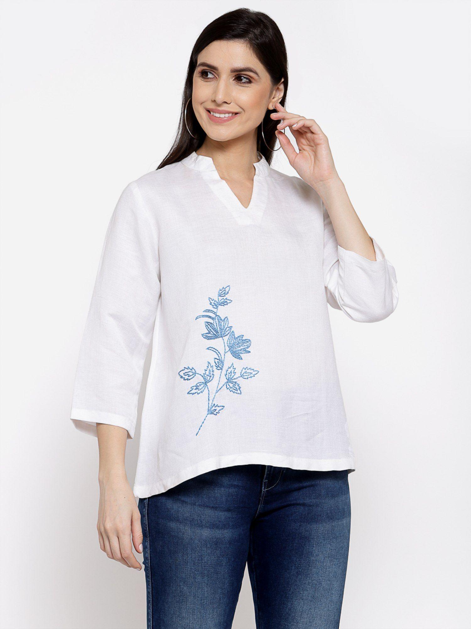 linen top with hand embroidery on it -white