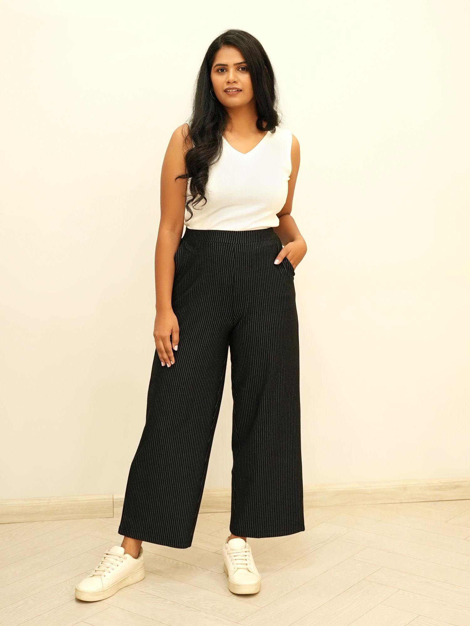 livin women striped relaxed flared parallel trousers - black