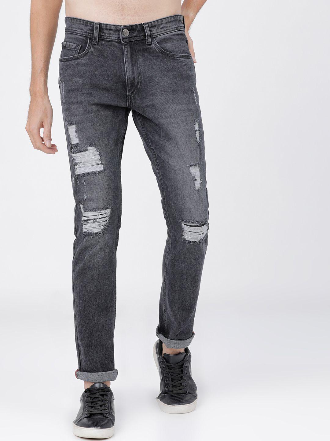 locomotive men black slim fit mid-rise highly distressed stretchable jeans