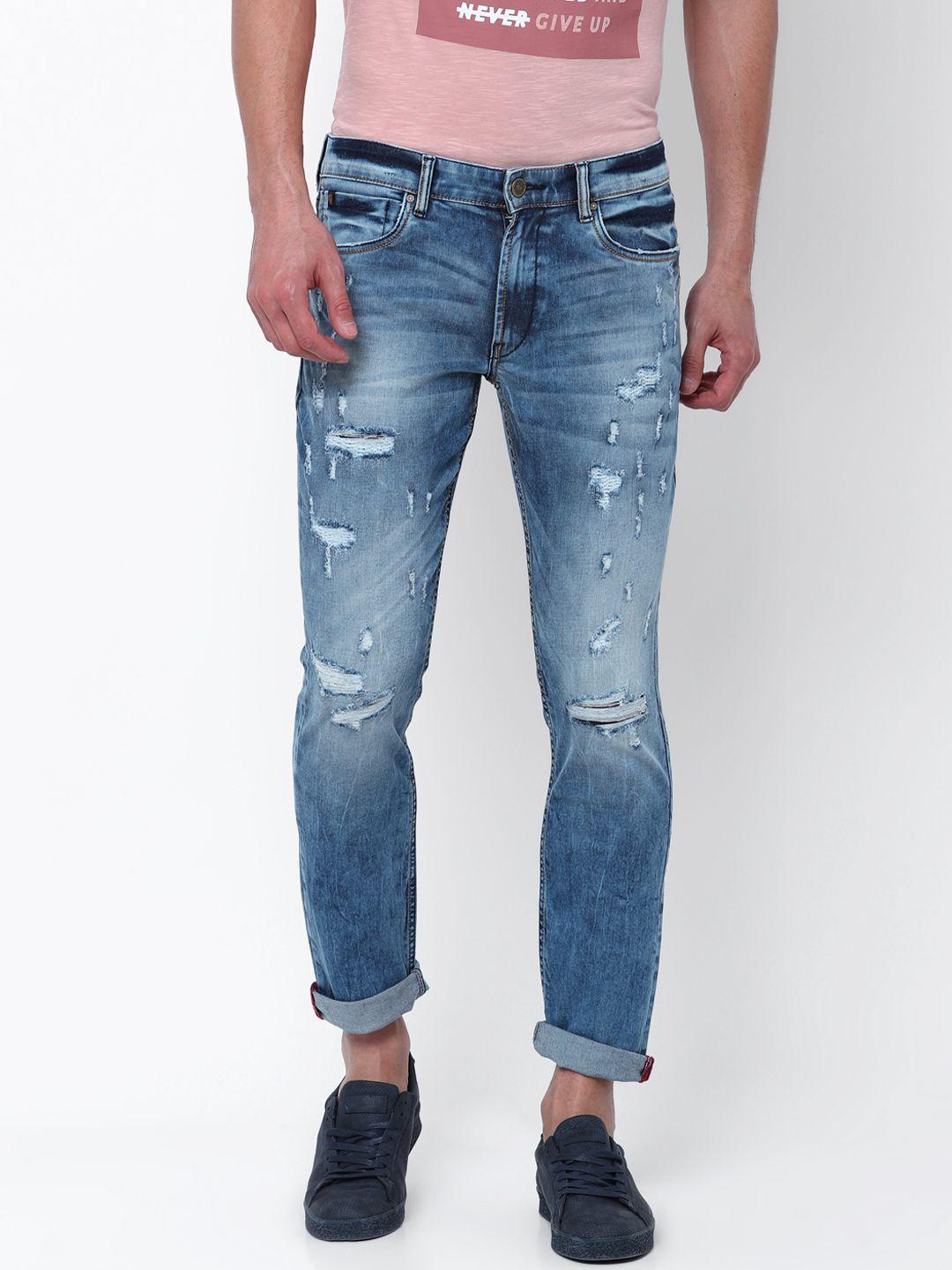 locomotive men blue slim fit mid-rise highly distressed stretchable jeans