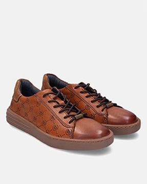 logo engraved lace-up leather sneakers