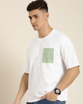 loose fit crew-neck t-shirt with patch pocket