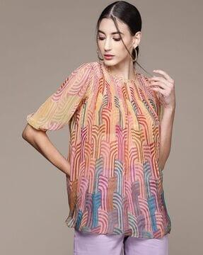 loose fit geometric print flared top