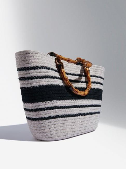 lov by westside black & beige woven textured hand bag