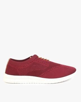 low-top lace-up shoes with perforations