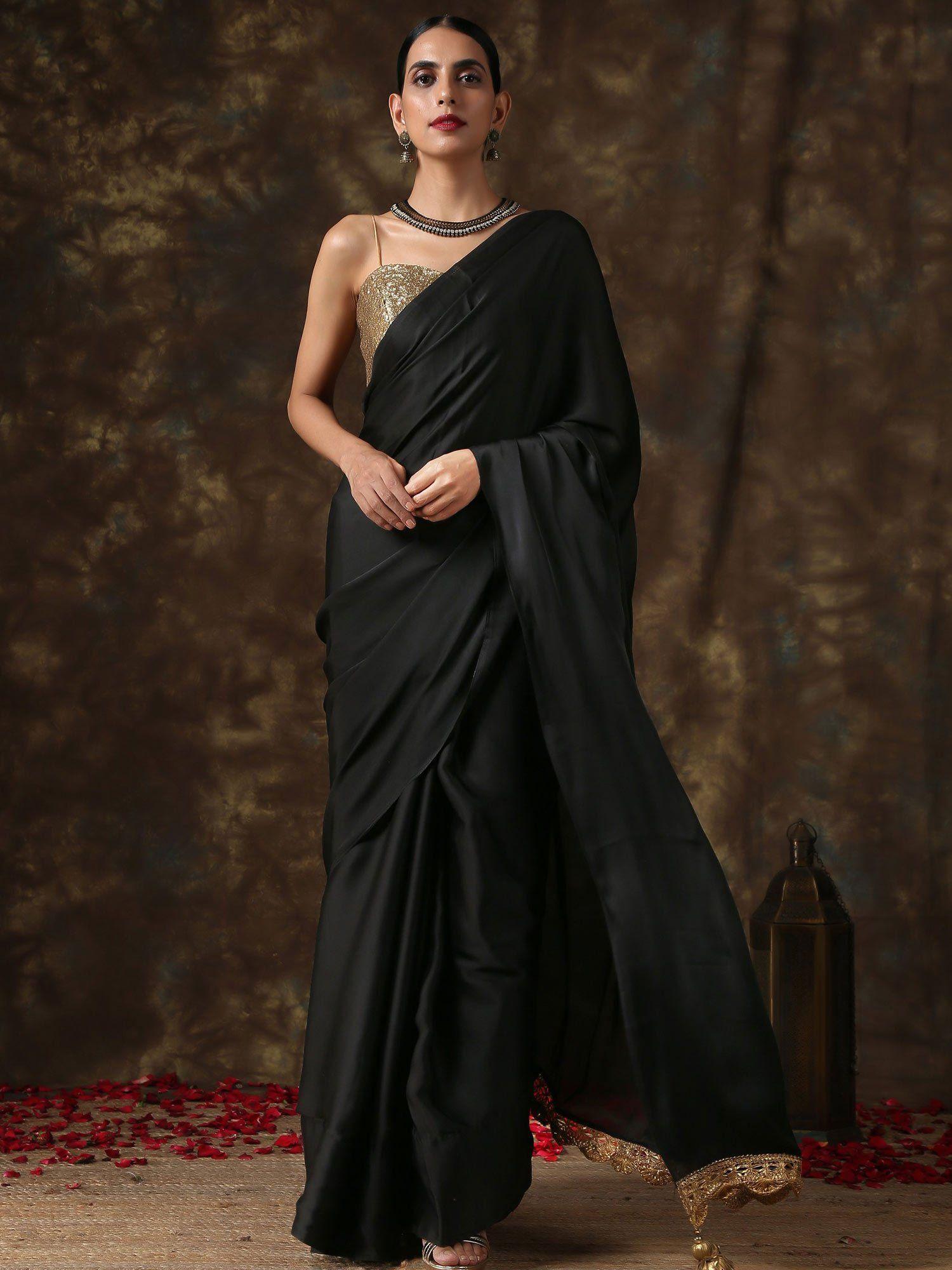 luxurious black satin saree with dull gold lace and pendants