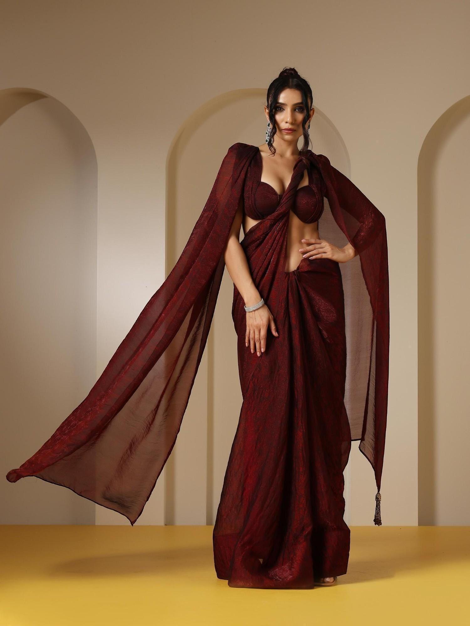 majestic maroon paisley chiffon saree with bronze long pendants