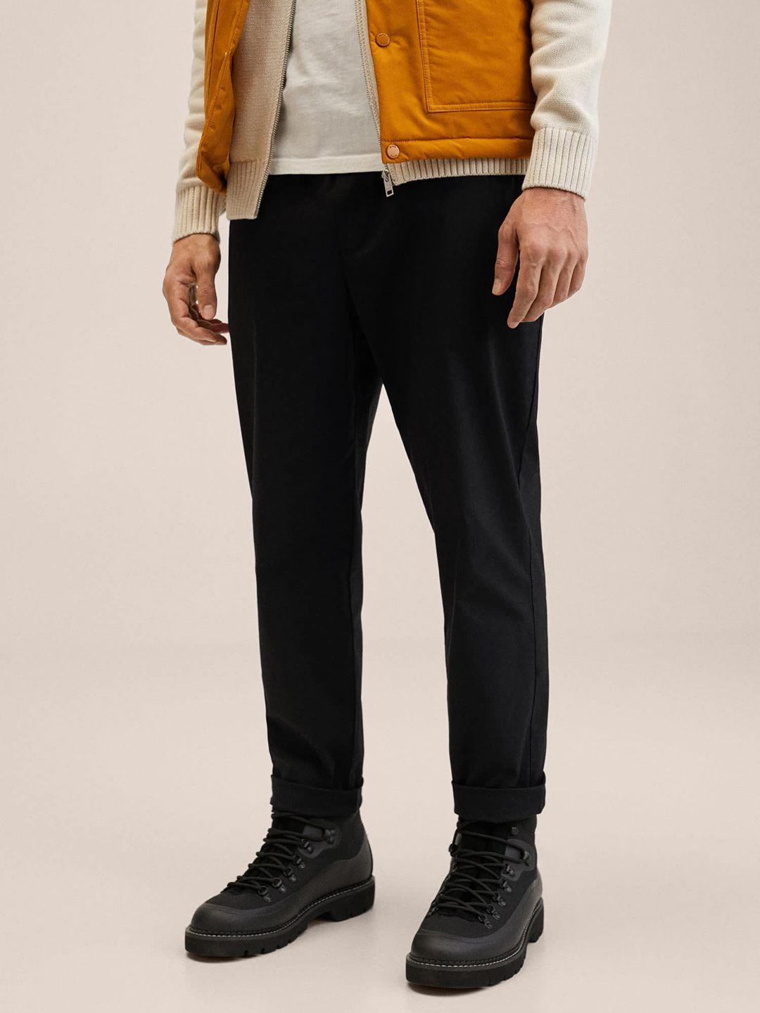 mango man black solid trousers