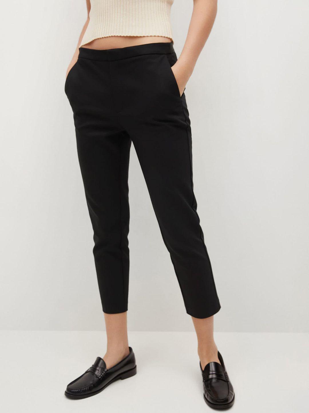 mango women black solid skinny fit trousers