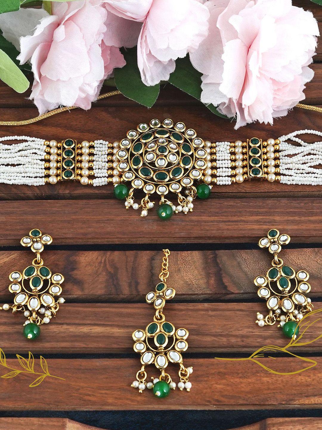 mansiyaorange gold-plated kundan-studded & beaded jewellery set with maang tika