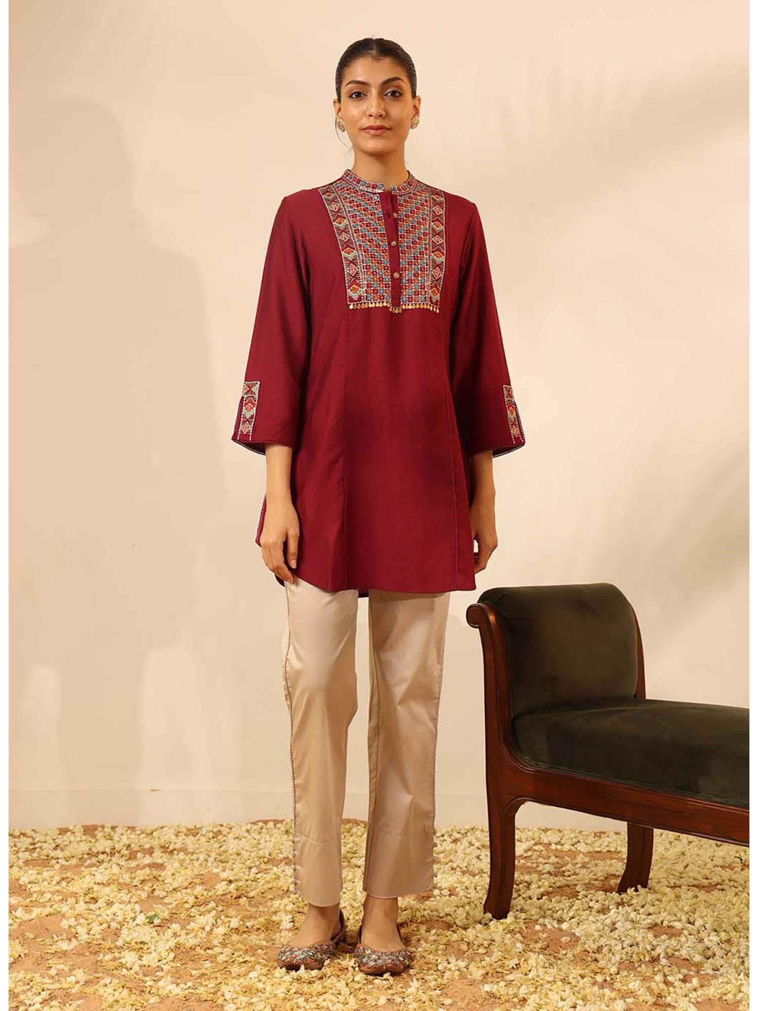 maroon collared tunic with intricate embroidery and three fourth sleeves