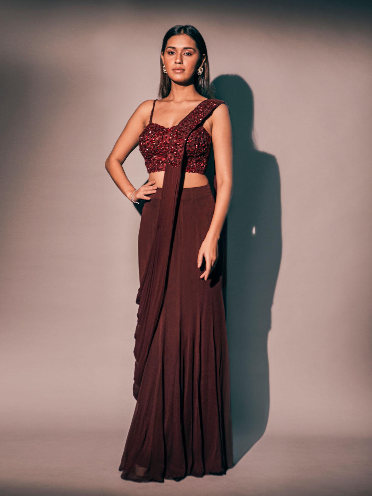 maroon corset style blouse paired with saree with stitched blouse