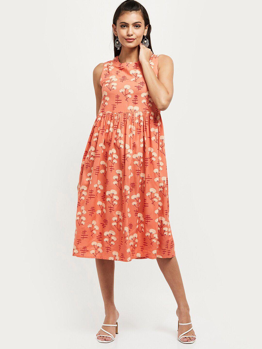 max peach-coloured floral print fit and flare dress