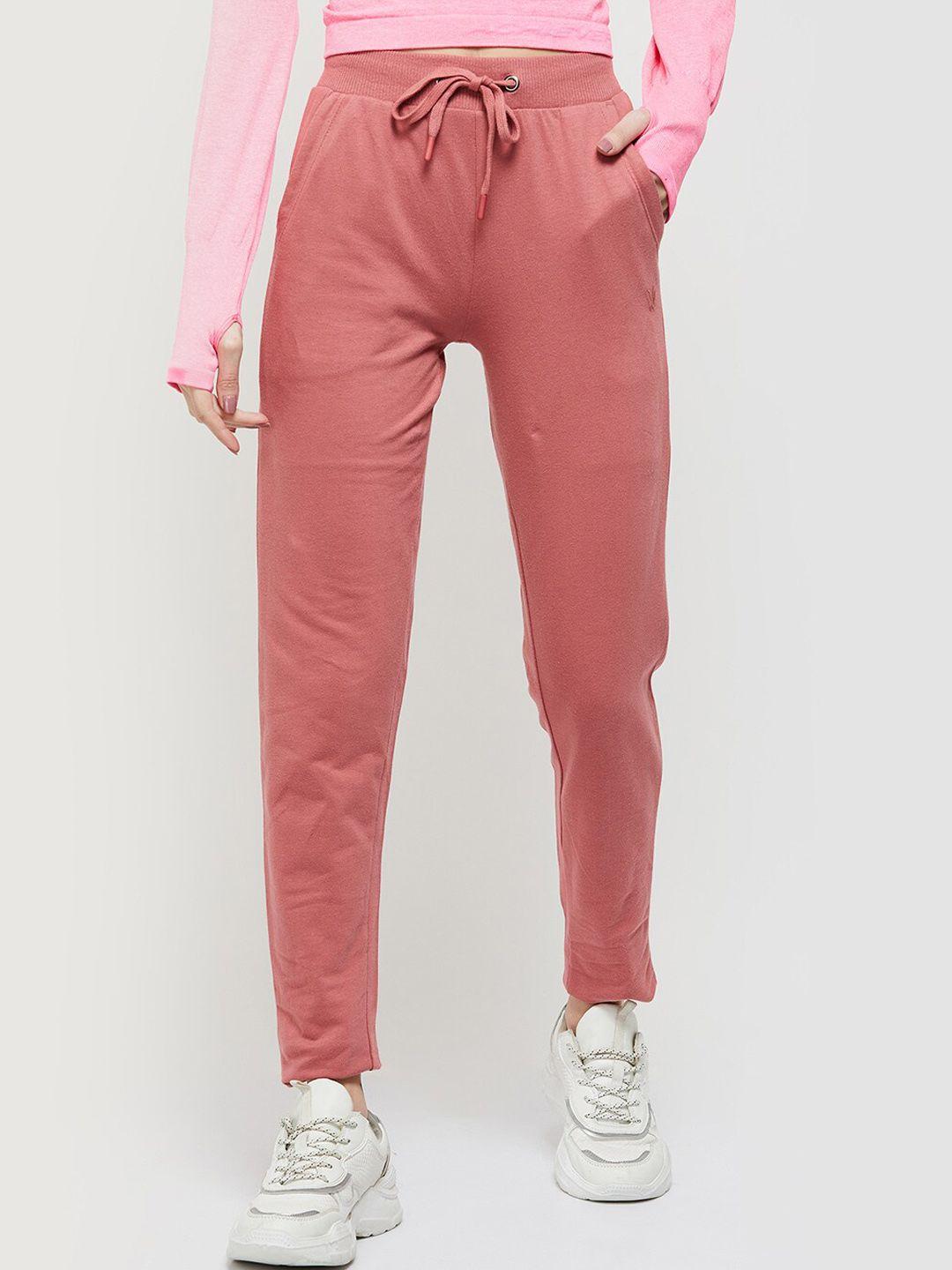 max women peach coloured solid cotton track pants