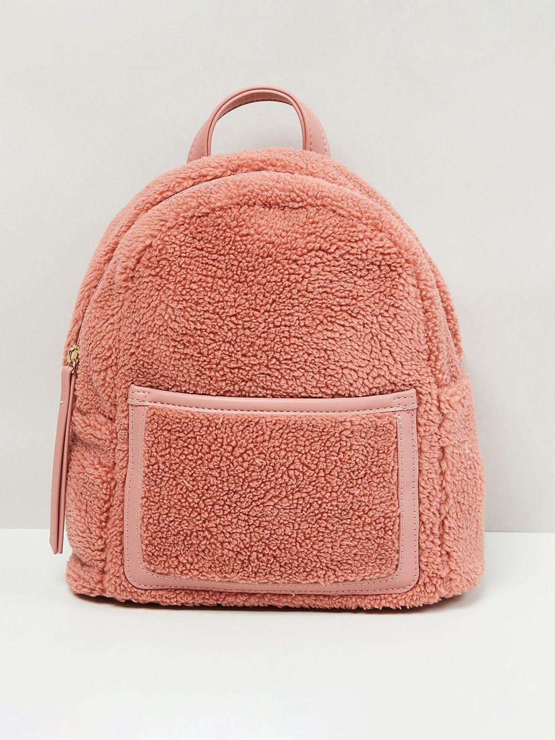 max women peach-coloured textured backpack