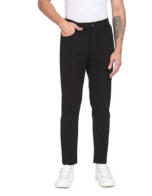 men black solid slim tapered fit casual trousers