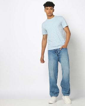 men heavily washed relaxed fit jeans