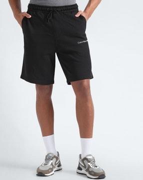 men institutional regular fit shorts with brand print