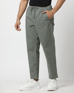 men low-rise comfort fit flat-front trousers