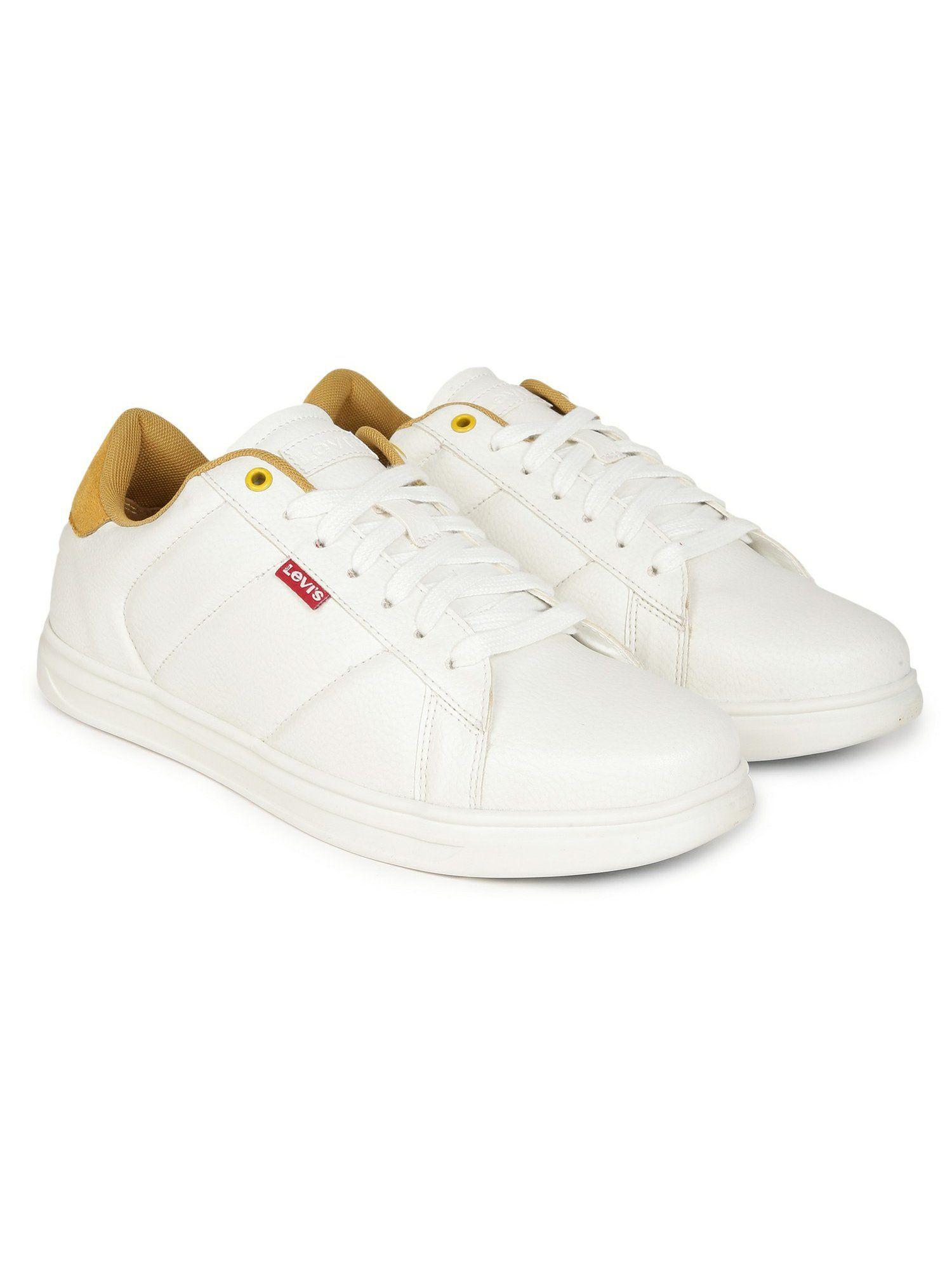 men white and yellow sneakers