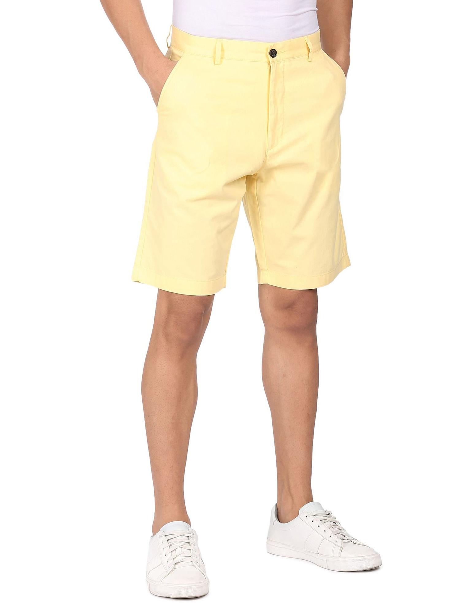 men yellow mid rise solid shorts
