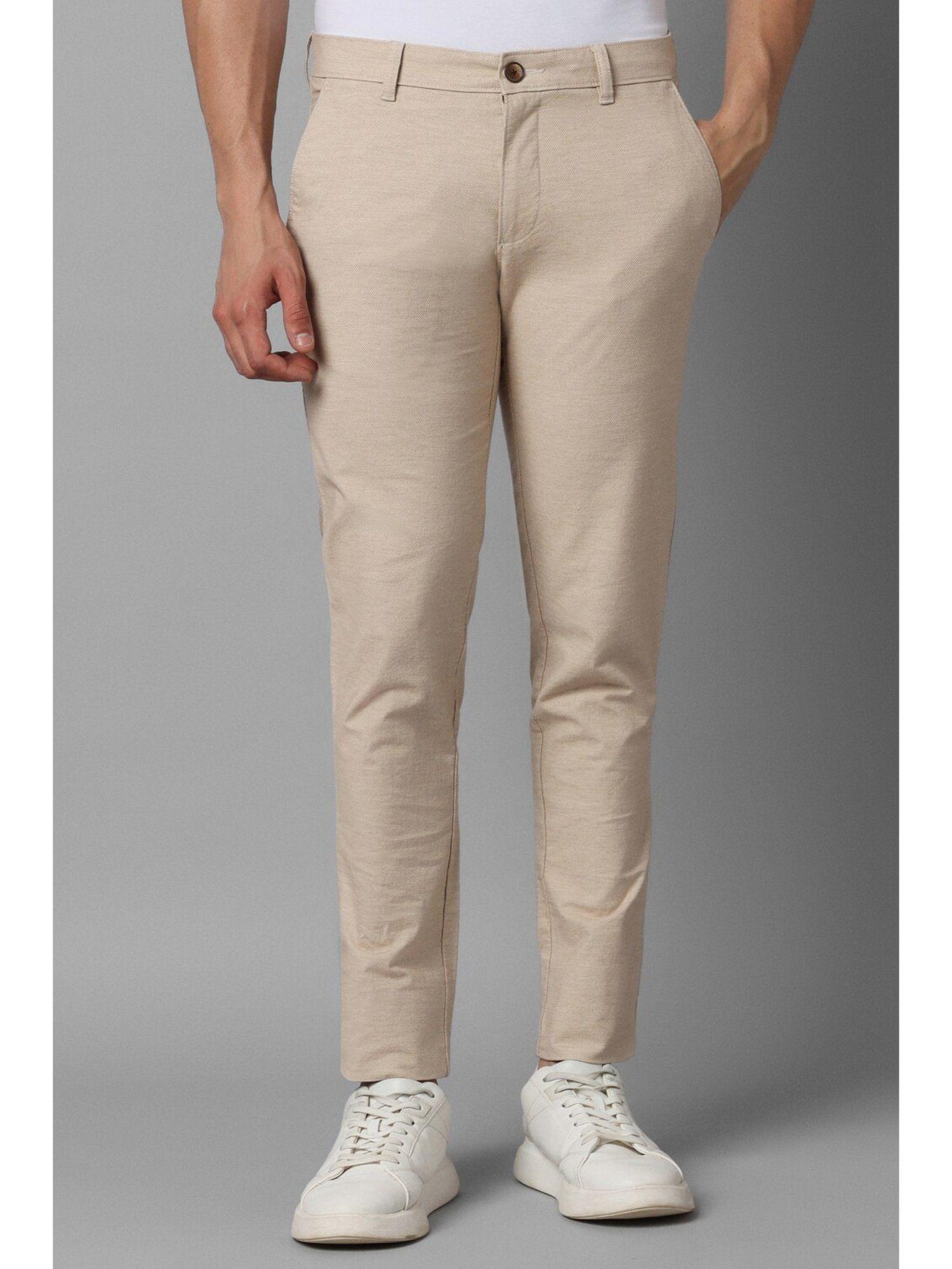 men beige slim tapered fit solid flat front casual trousers