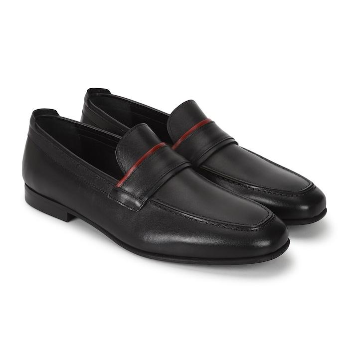 men black penny loafers with red piping at band