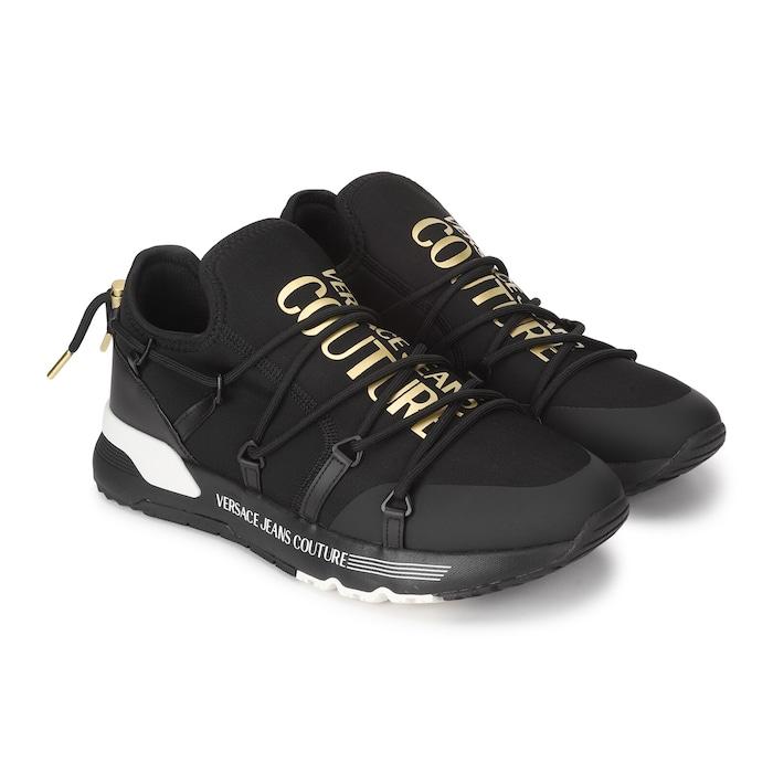 men black shoes with golden branding on tongue