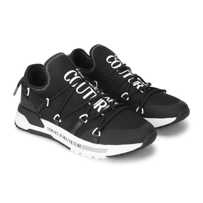 men black shoes with white branding on tongue